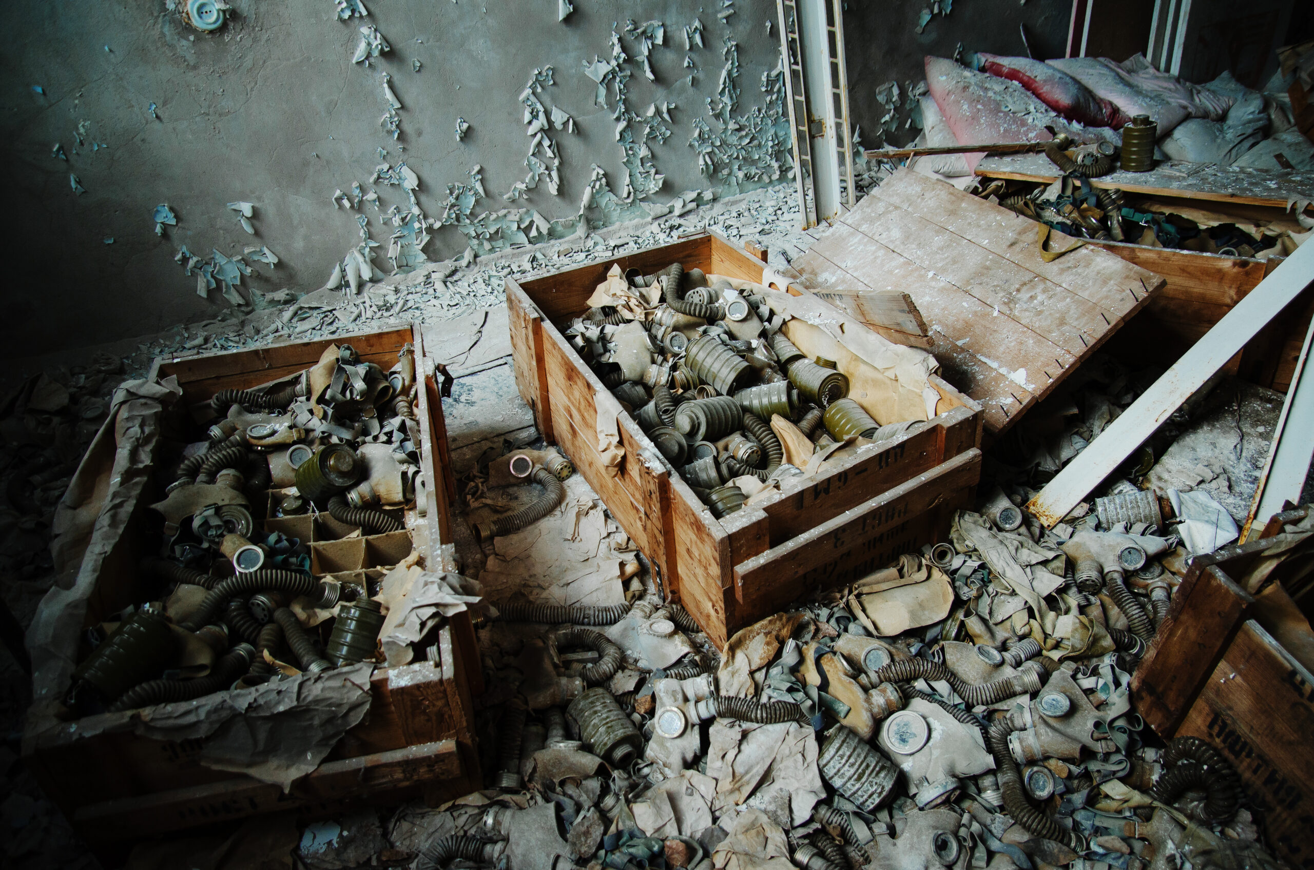 Infected radiation gas masks on the floor at boxes at Chernobyl nuclear power plant zone of alienation.